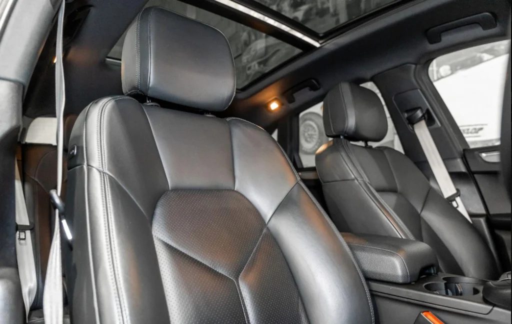 Front seats of the grey 2019 Porsche Macan, available for hire in Sydney