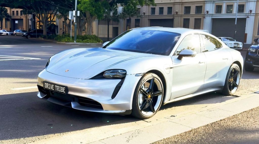 Silver 2021 Porsche Taycan Turbo, front three-quarter view, available for hire in Sydney