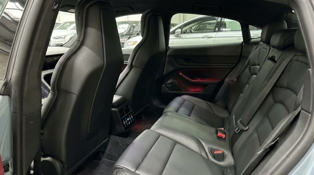 Rear seats of the silver 2021 Porsche Taycan Turbo, available for hire in Sydney