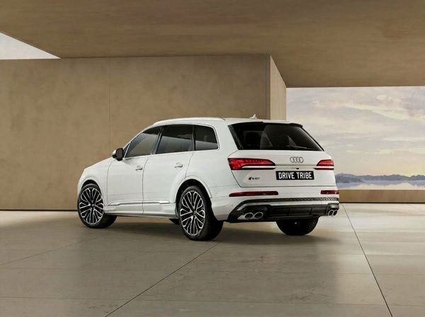 White 2021 Audi Q7 45 TDI quattro, rear three-quarter view, available for hire in Sydney