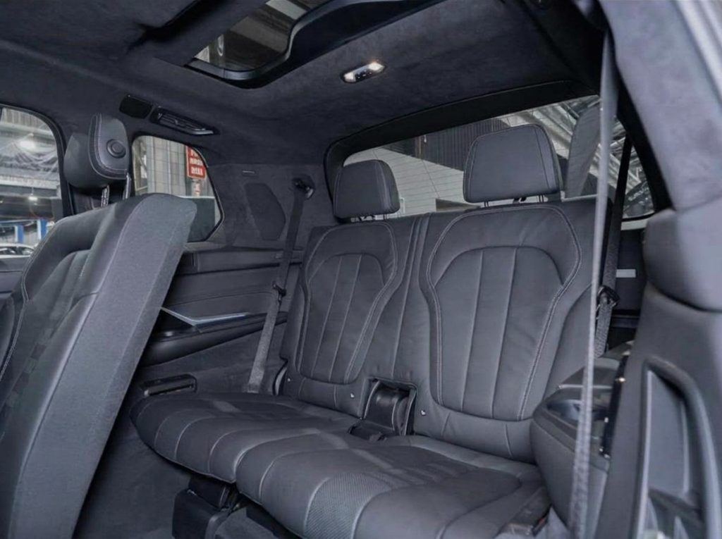 Rear seats of the blue 2019 BMW X7 xDrive30d, available for hire in Sydney