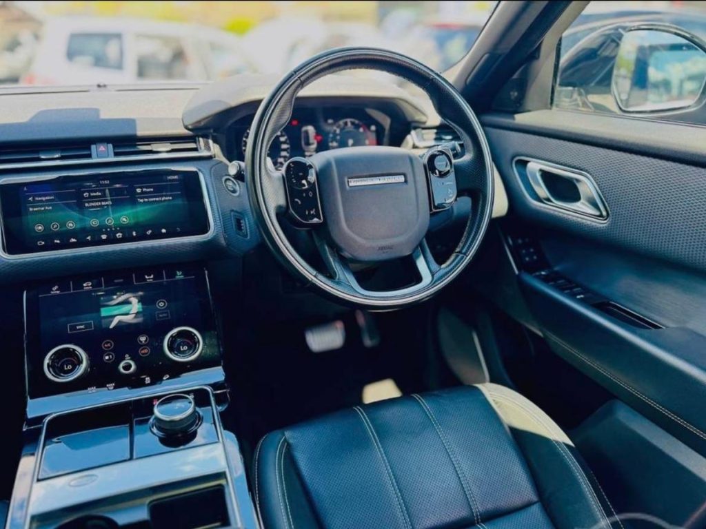 Steering wheel of the white 2018 Land Rover Range Rover Velar, available for hire in Sydney