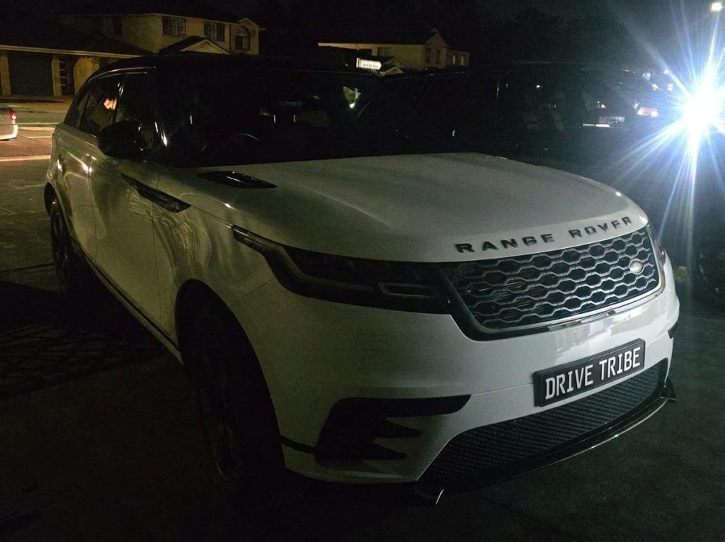 White 2018 Land Rover Range Rover Velar, front three-quarter view, available for hire in Sydney