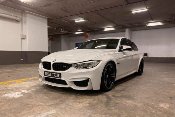 White 2016 BMW M3 Competition F80, front three-quarter view, available for hire in Sydney