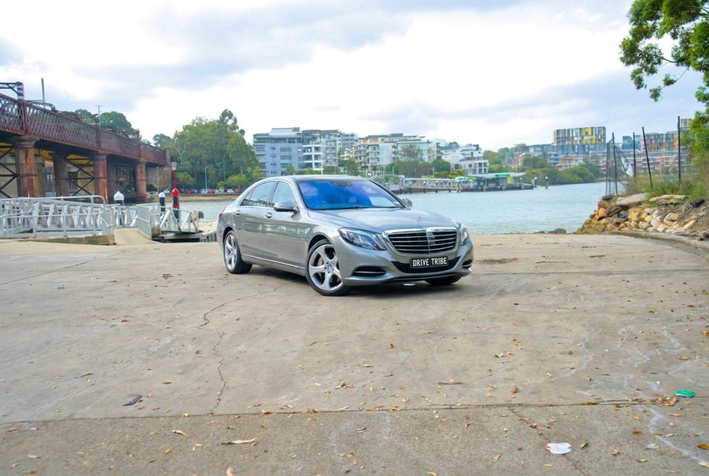 Silver 2015 Mercedes-Benz S500 L, front three-quarter view, available for hire in Sydney