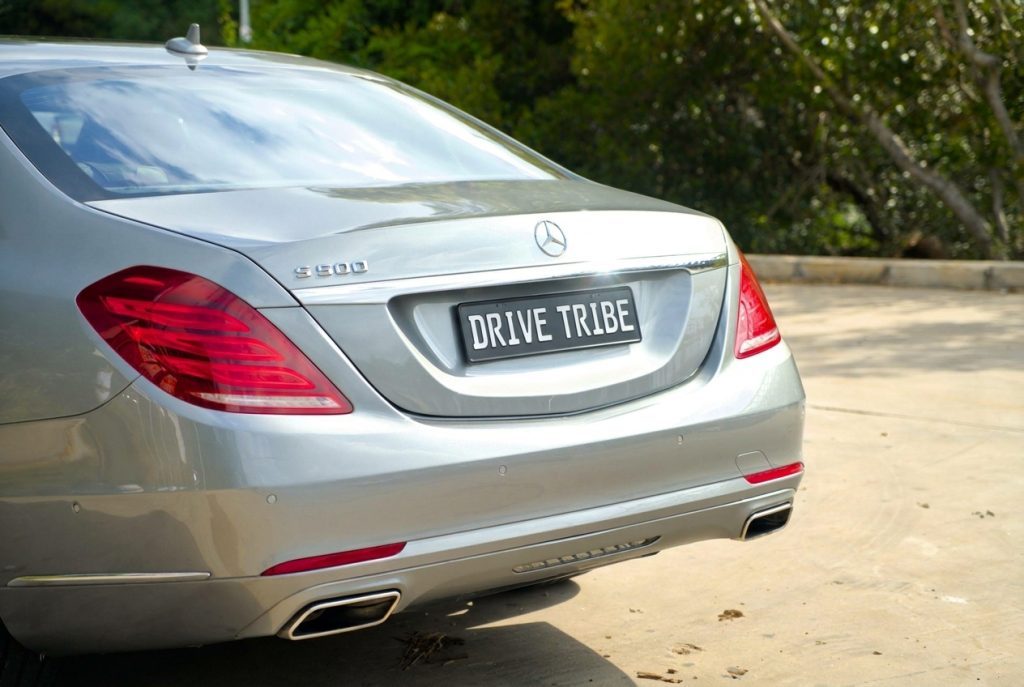 Silver 2015 Mercedes-Benz S500 L, rear view, available for hire in Sydney