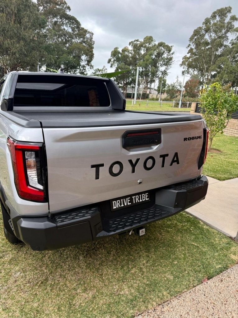 Silver 2026 Toyota HiLux Rogue 4x4, rear three-quarter view, available for hire in Sydney