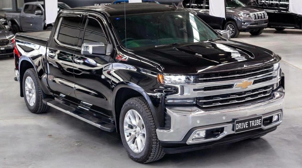 Black 2022 Chevrolet Silverado 1500 Trail Boss, front three-quarter view, available for hire in Sydney
