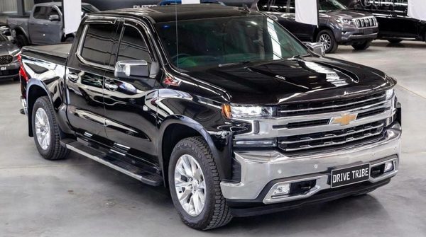 Black 2022 Chevrolet Silverado 1500 Trail Boss, front three-quarter view, available for hire in Sydney
