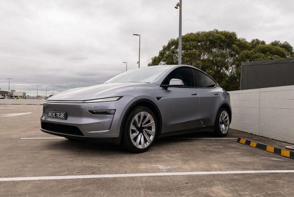 Silver 2025 Tesla Model Y RWD, front three-quarter view, available for hire in Sydney
