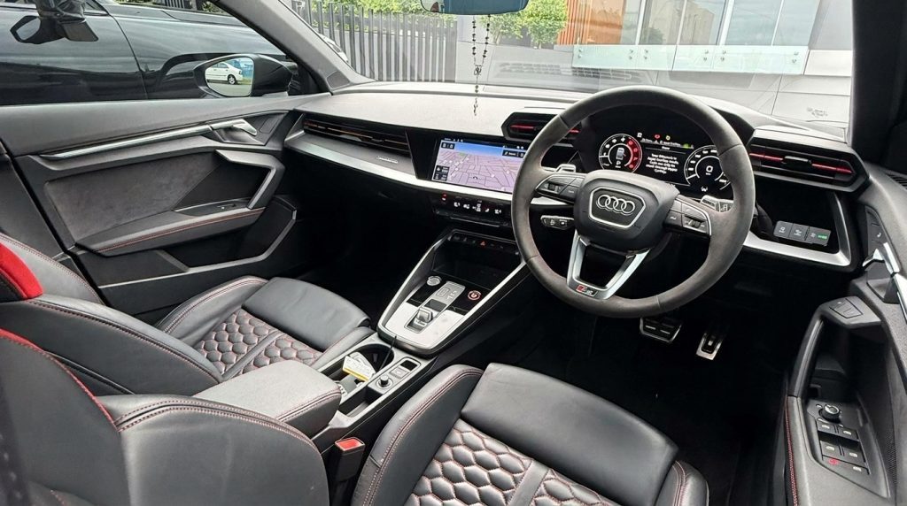 Dashboard of the black 2022 Audi RS 3 Sportback, available for hire in Sydney
