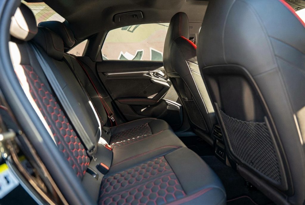 Rear seats of the black 2022 Audi RS 3 Sportback, available for hire in Sydney