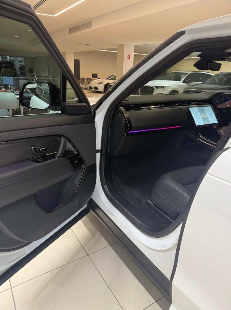 Interior of the white 2024 Land Rover Range Rover Sport D300 SE Dynamic, available for hire in Sydney