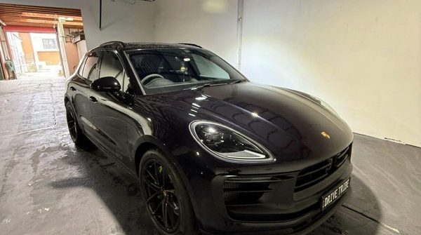 Black 2024 Porsche Macan GTS, front three-quarter view, available for hire in Sydney