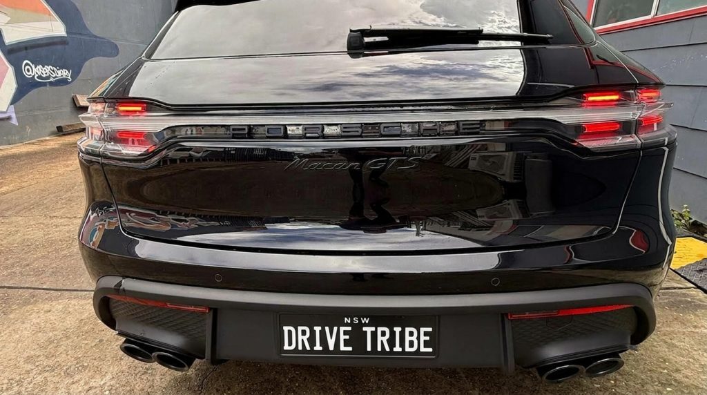 Black 2024 Porsche Macan GTS, rear view, available for hire in Sydney