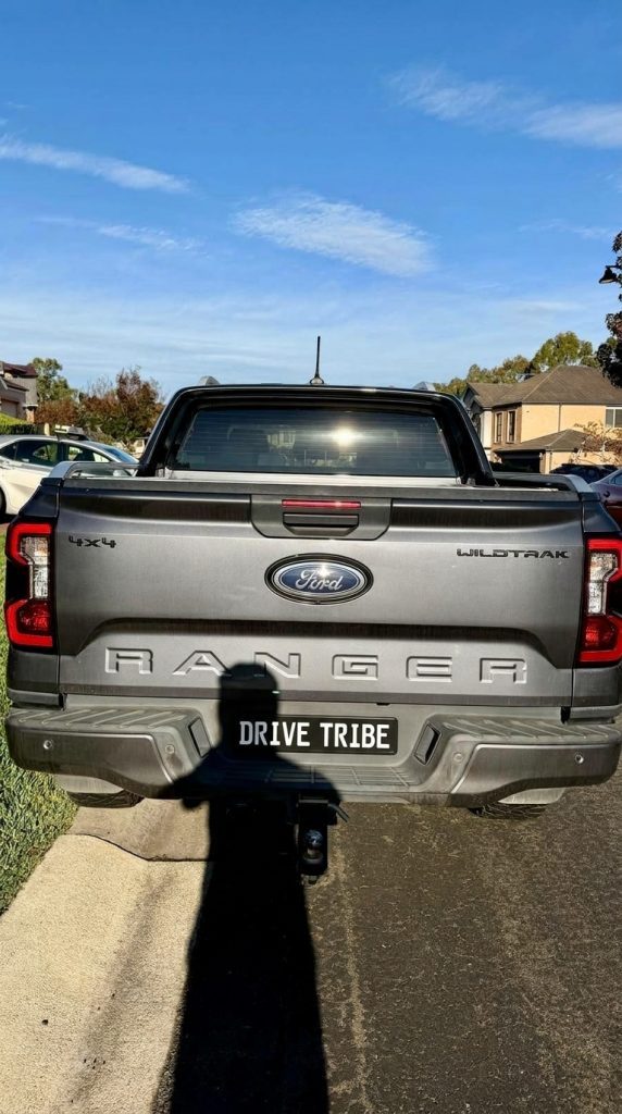 Grey 2022 Ford Ranger Wildtrak 4x4, rear view, available for hire in Sydney