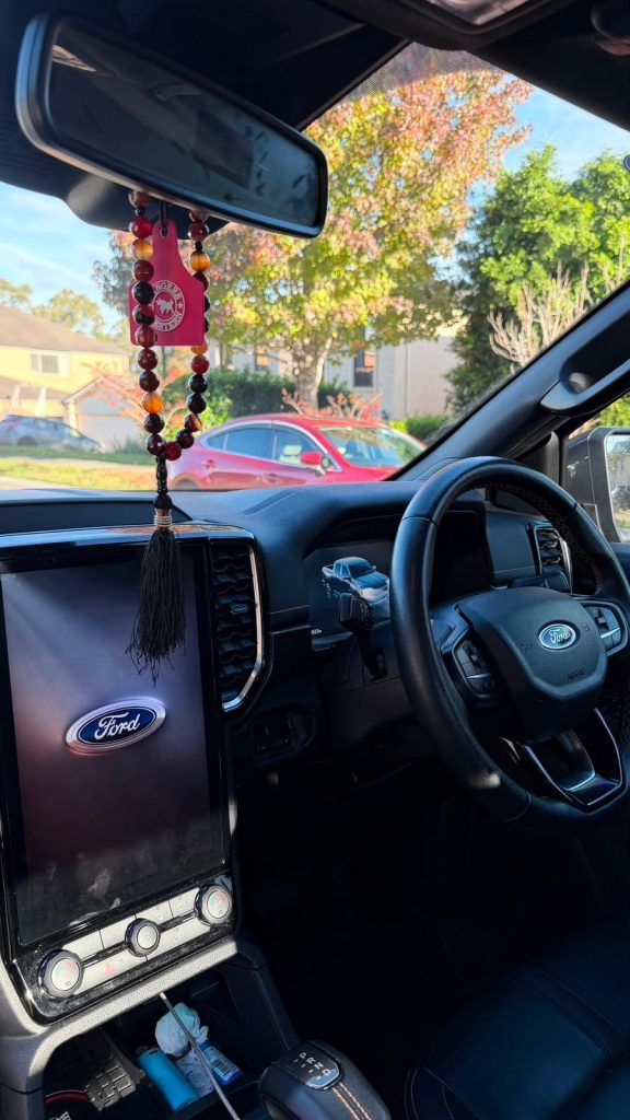 Infotainment screen of the grey 2022 Ford Ranger Wildtrak 4x4, available for hire in Sydney