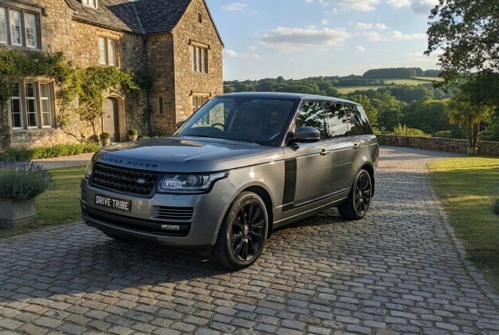 Grey 2013 Land Rover Range Rover Vogue, front three-quarter view, available for hire in Sydney